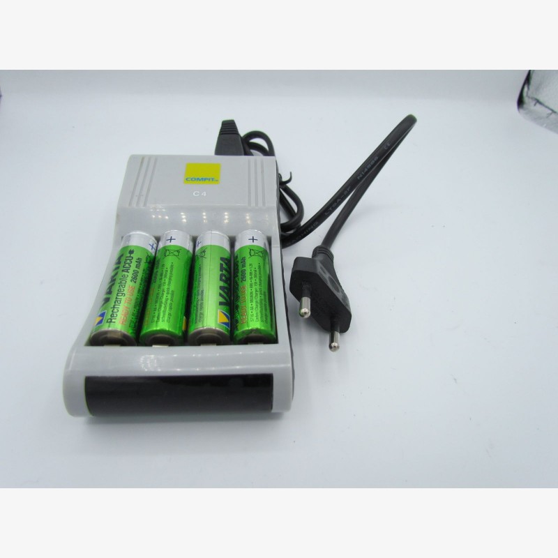 Charger and 4 used AA batteries