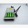 Charger and 4 used AA batteries
